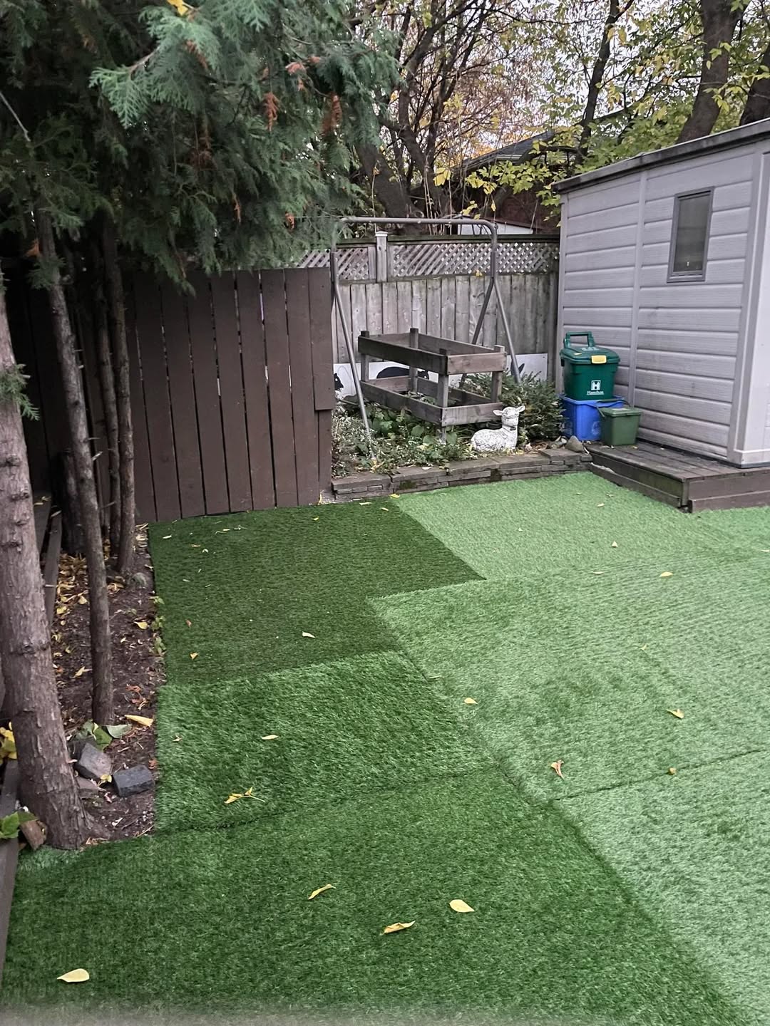 Artificial turf lawn covered in heavy snow and ice in a Sudbury Ontario winter backyard