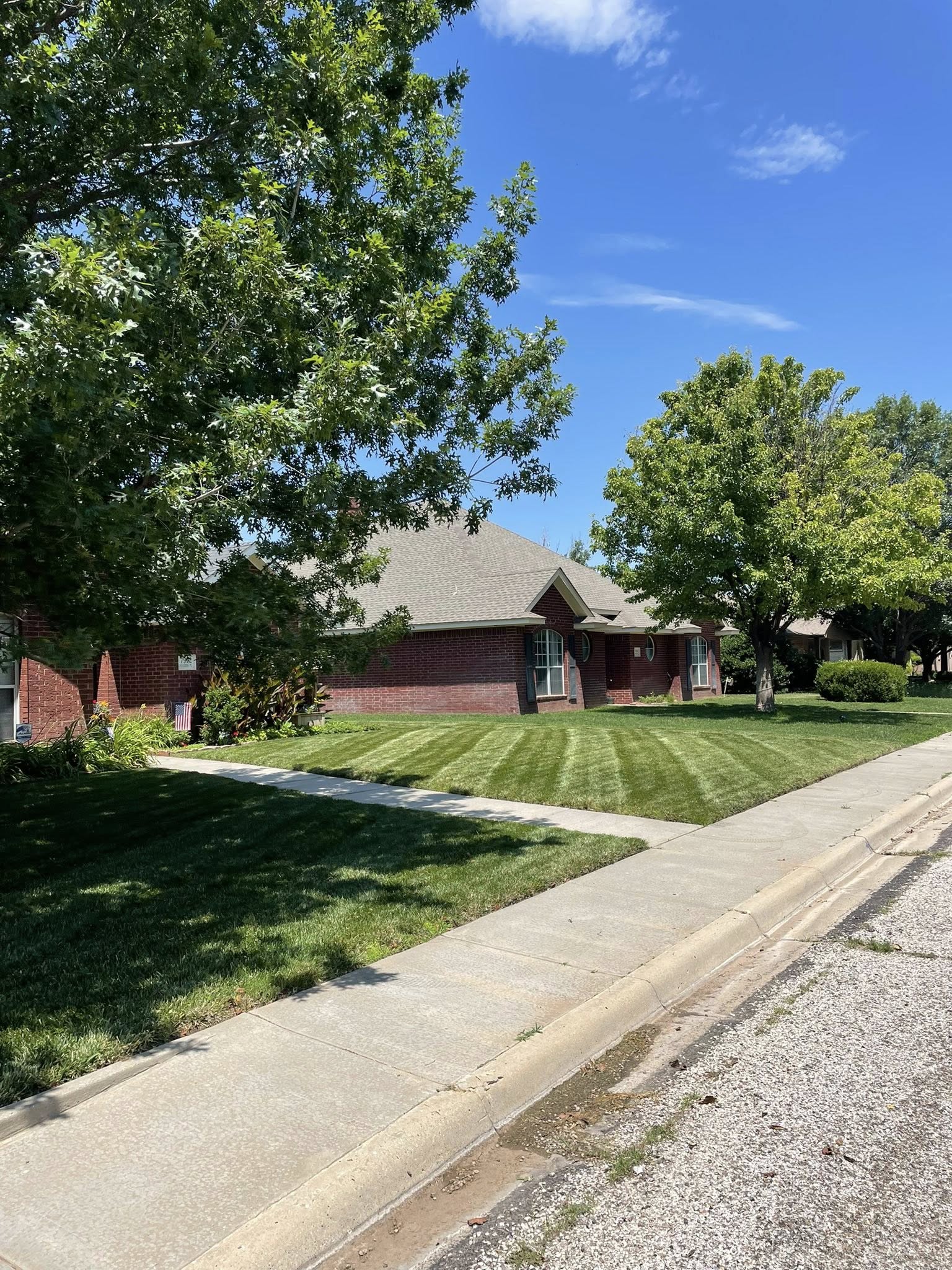Clean lawn edges driveway Sudbury property