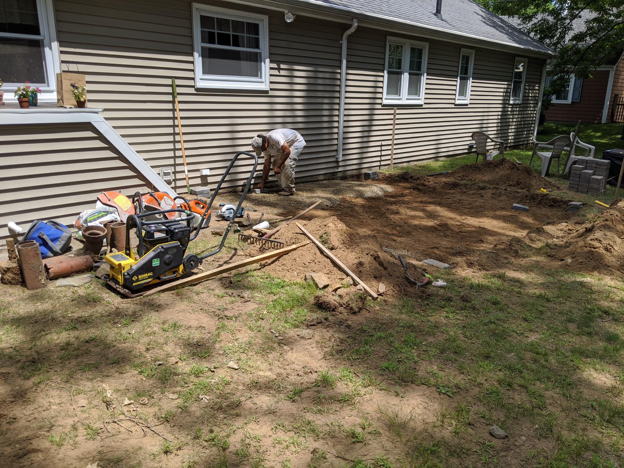 Core aeration plugs on a Sudbury lawn after spring service