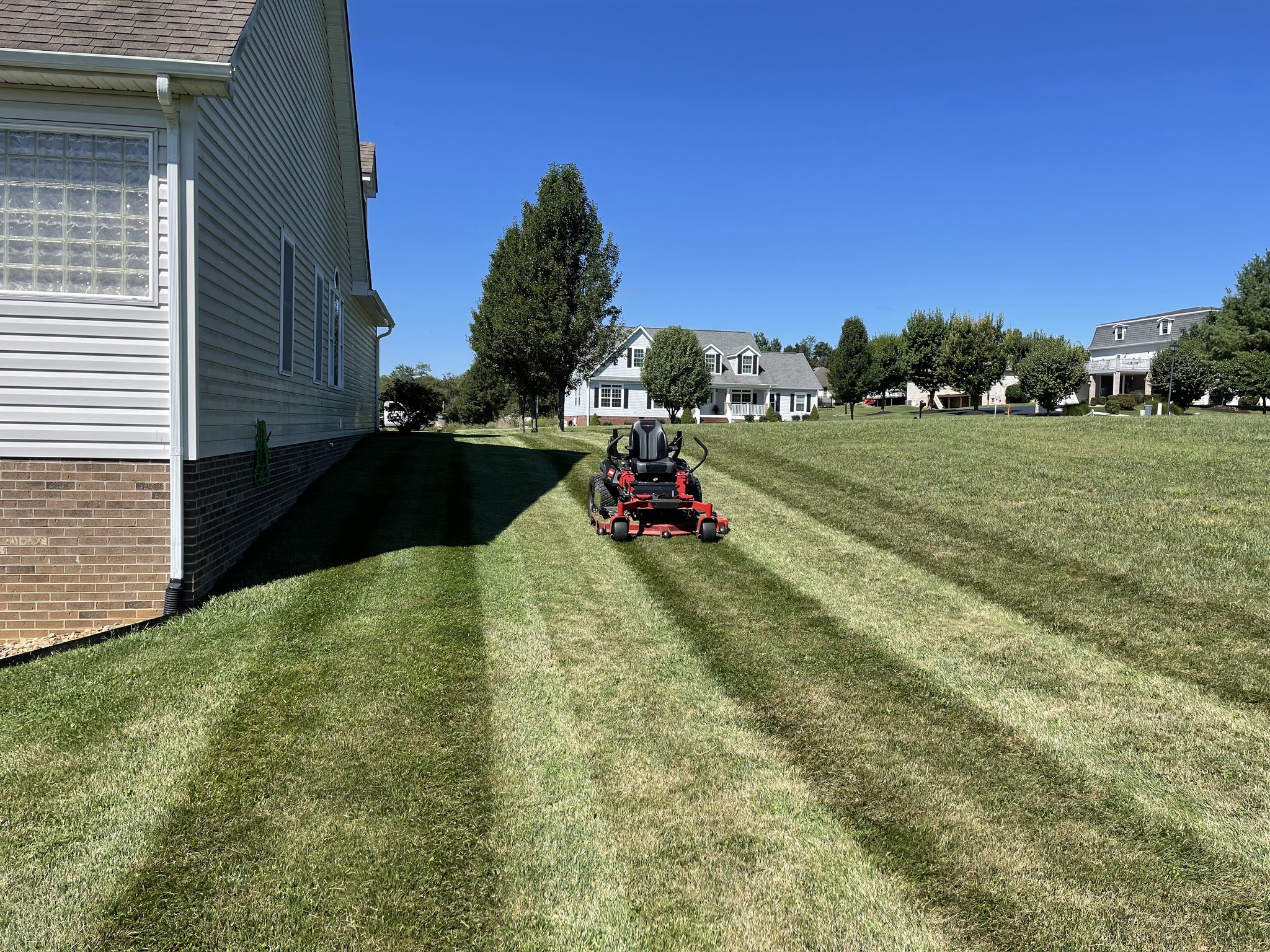 First lawn mowing of spring season on a Sudbury Ontario property in late May 2026