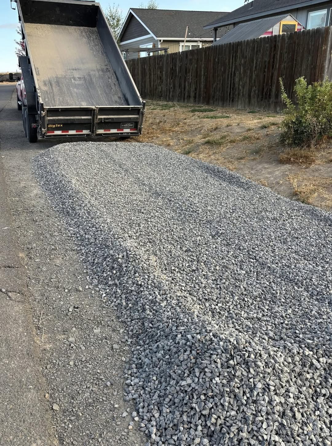 Gravel being spread and graded on a driveway in Greater Sudbury