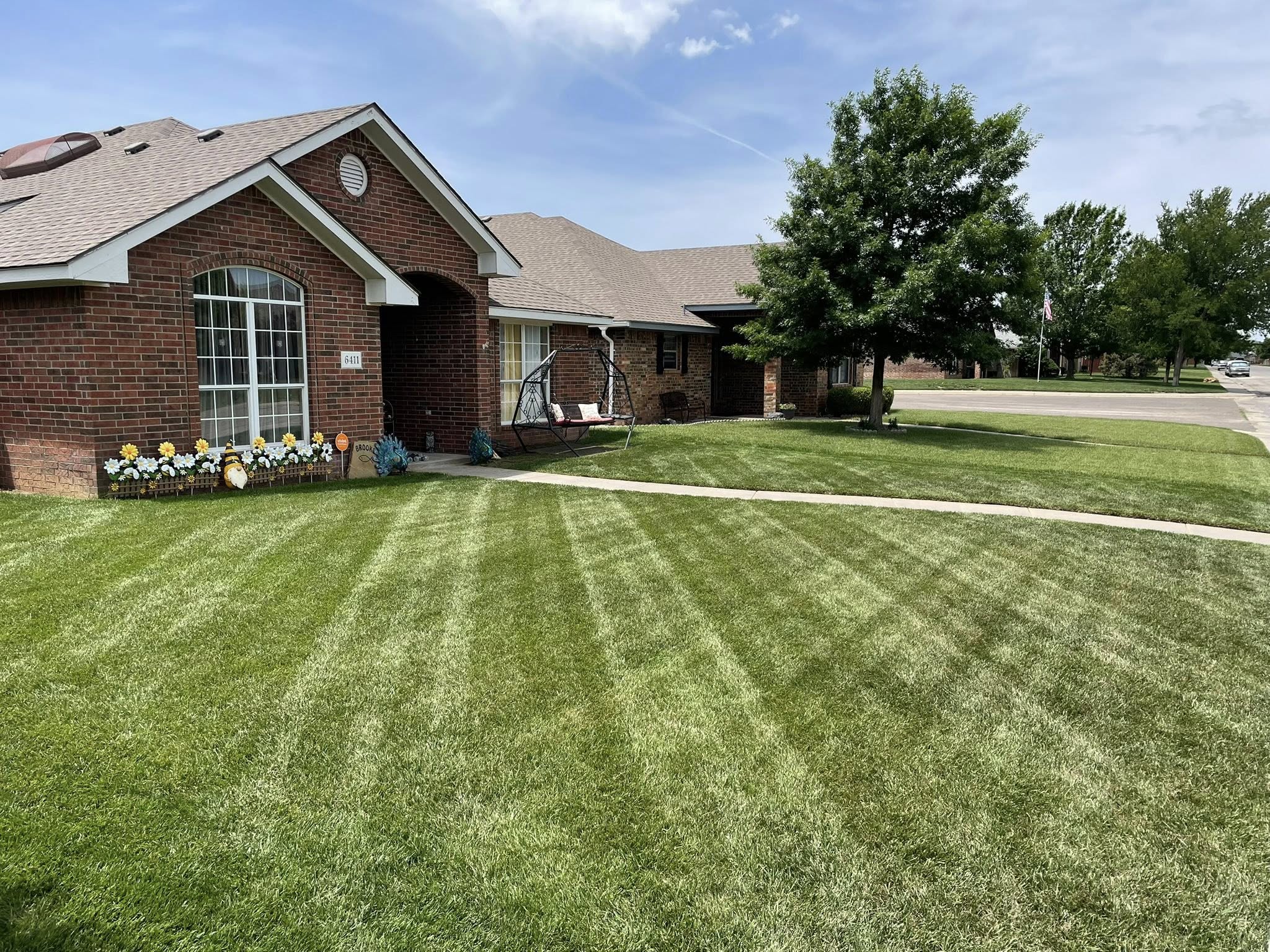 Healthy green lawn maintained by Cutting Edge Lawn Sudbury