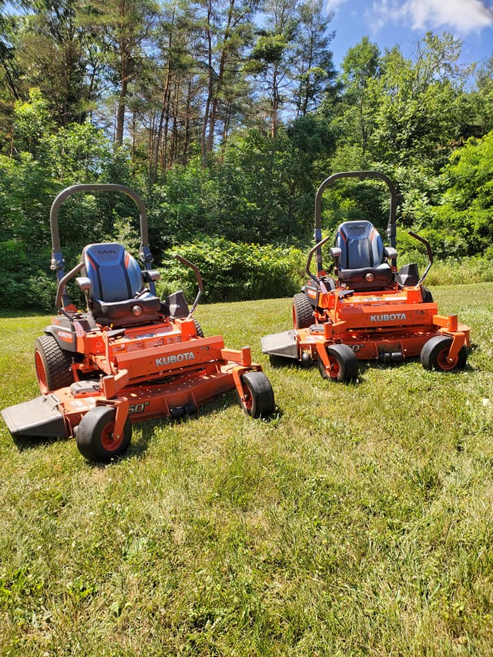 Lawn mower cutting residential grass in Greater Sudbury