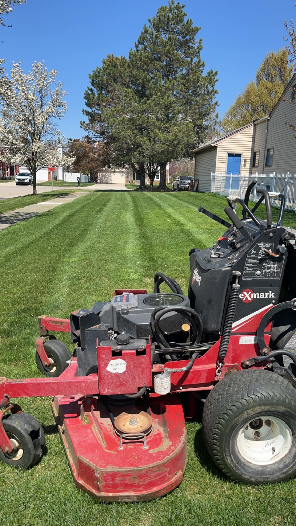 Mower deck height adjustment being set to 3 inches for Sudbury lawn