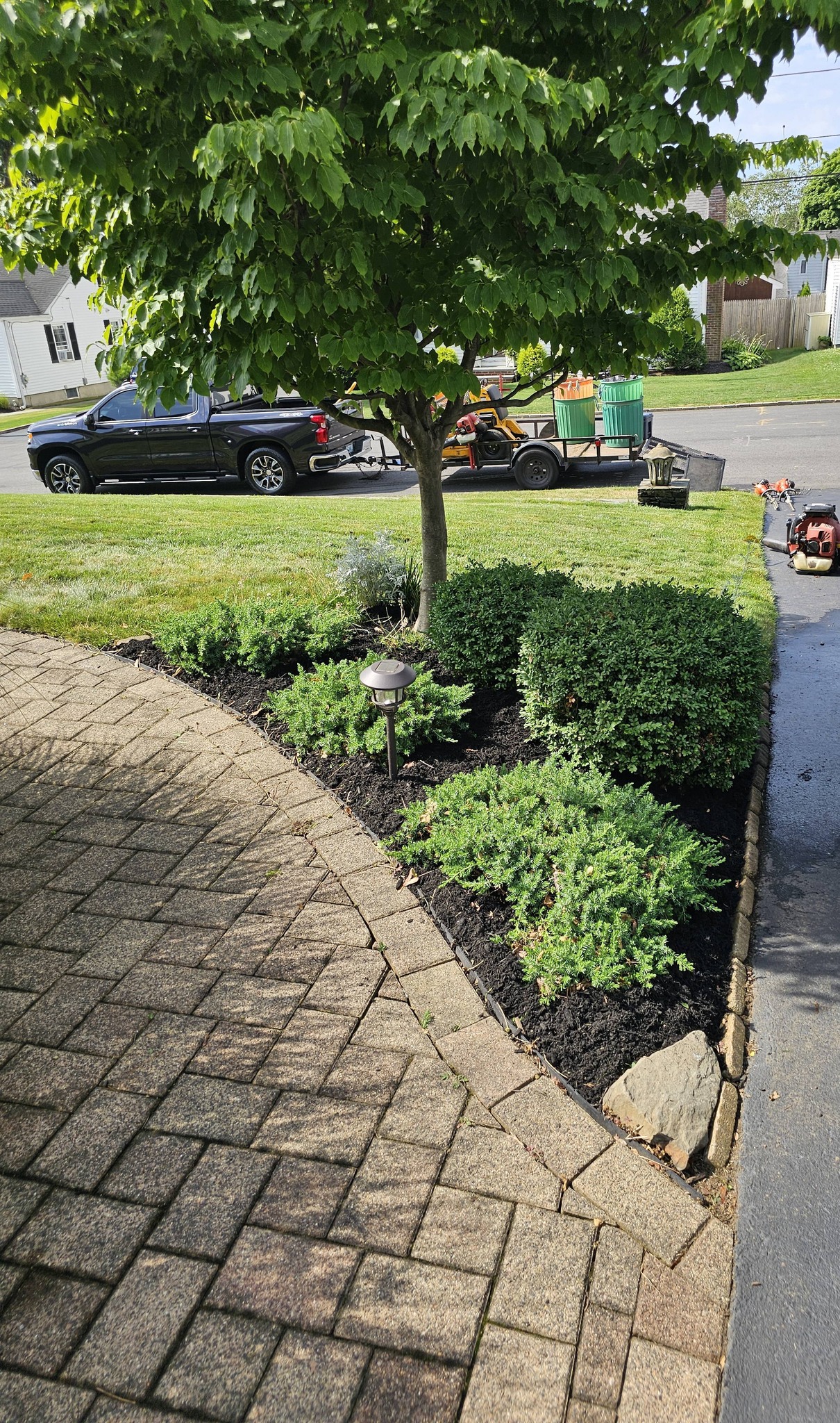 Neatly mowed residential lawn with clean edges in Greater Sudbury Ontario early summer