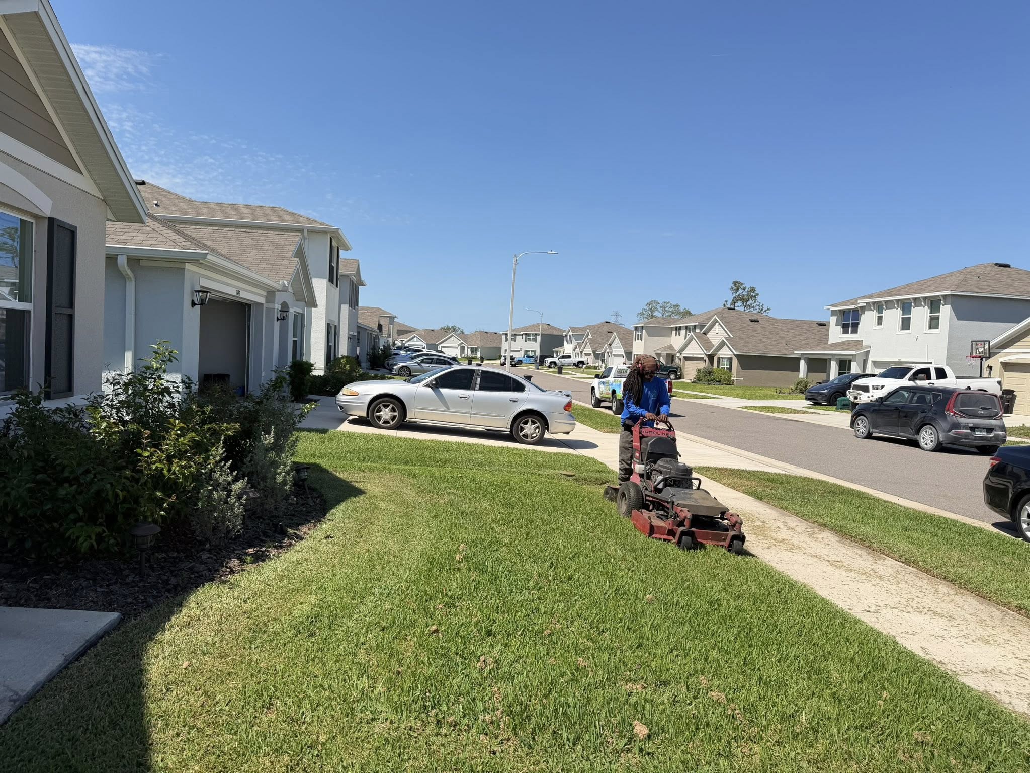 Professional grass cutting service on a Sudbury property before home listing