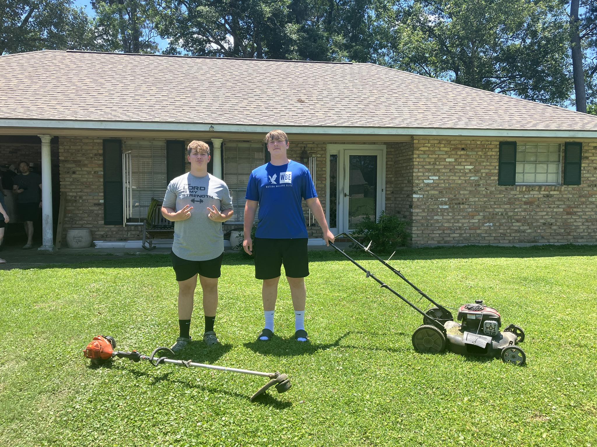 Ryan Lingenfelter reviewing lawn care schedule clipboard Garson Ontario