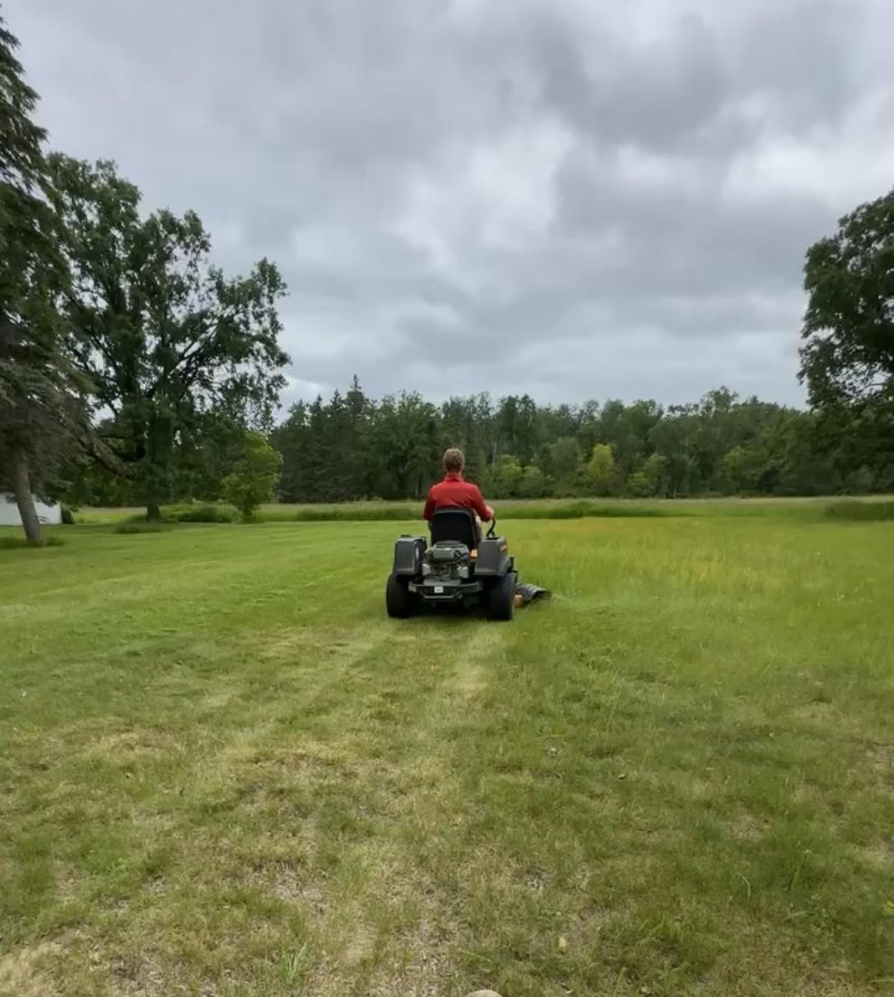 Ryan Lingenfelter working residential lawn Garson Ontario