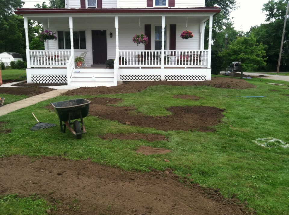 Topsoil being spread before sod installation in Sudbury