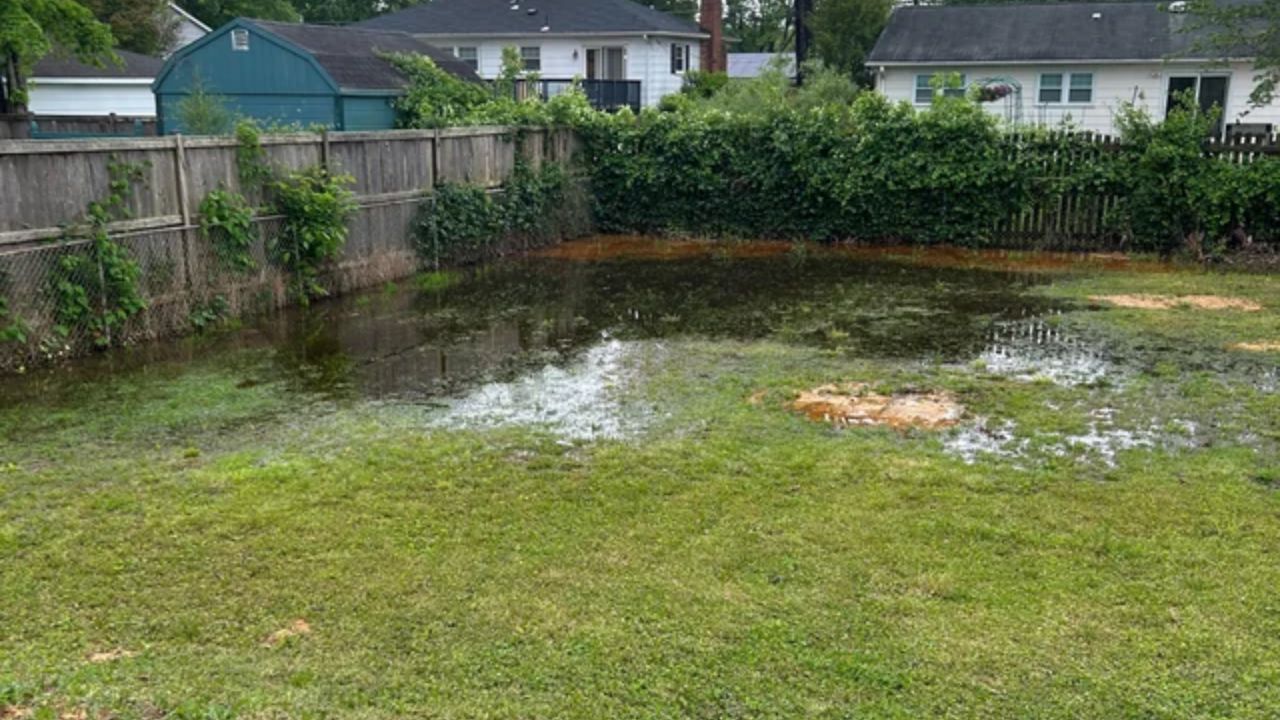 Backyard pool with damaged grass on a residential property in Greater Sudbury Ontario