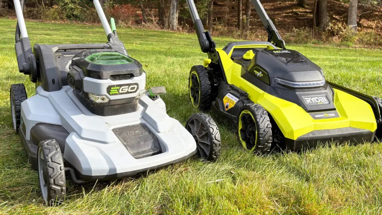 Battery and gas lawn mowers side by side on Sudbury lawn