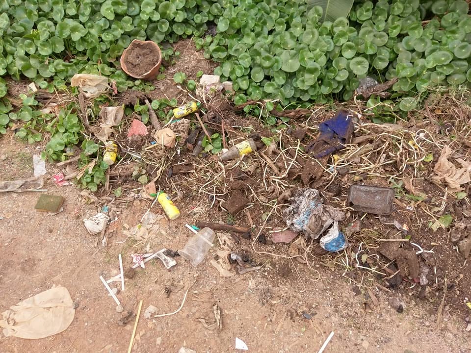 Buried construction debris and old landscaping materials uncovered under lawn in Sudbury Ontario