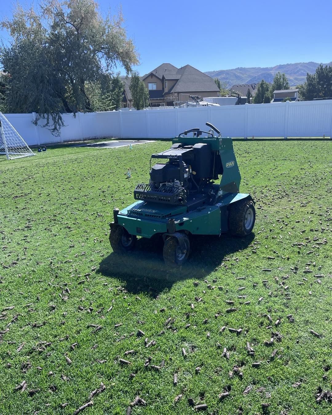 Core aeration and lawn preparation work being done on a long established Sudbury Ontario residential property