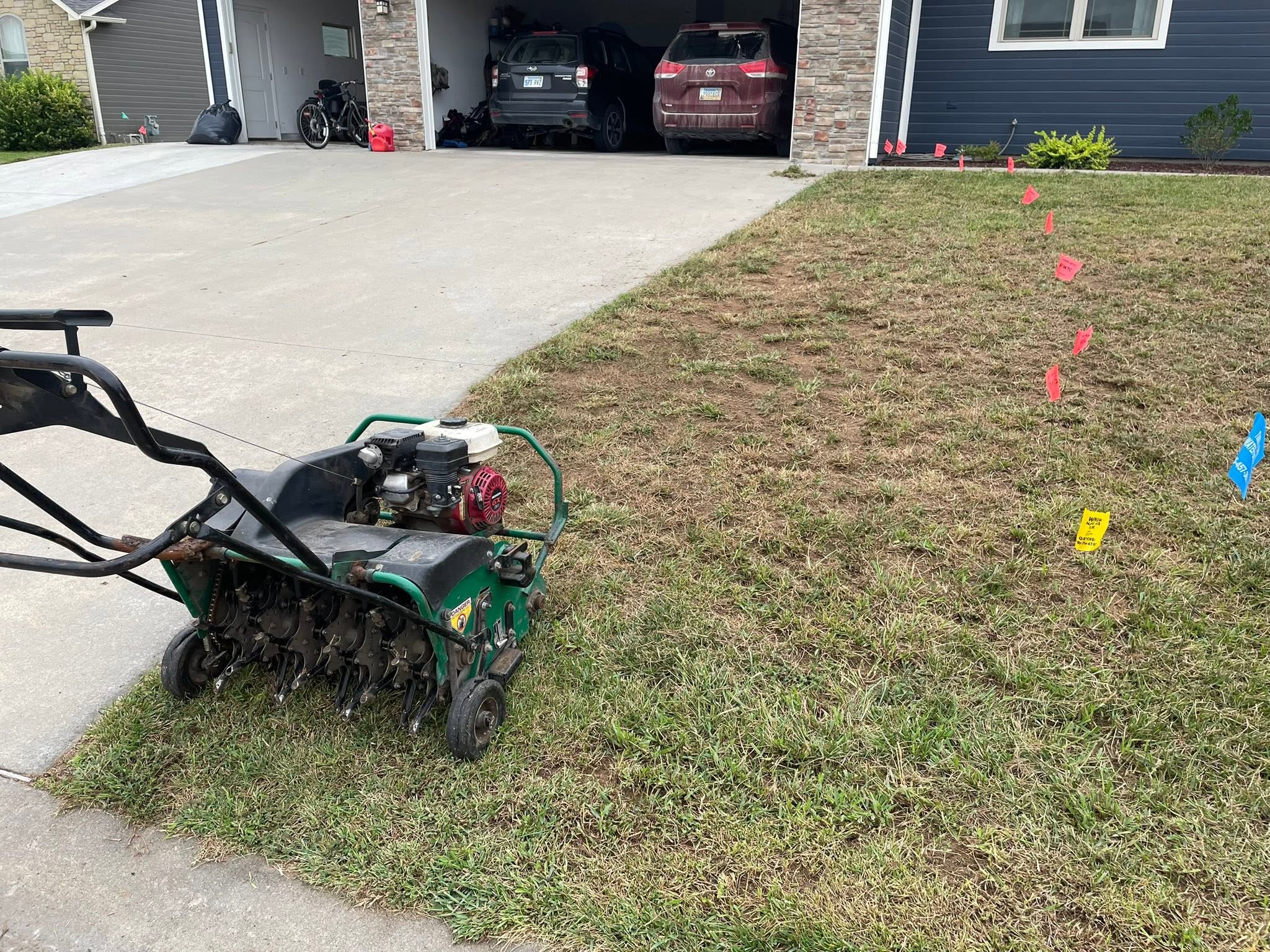 Core aeration and overseeding work on Sudbury lawn in June window