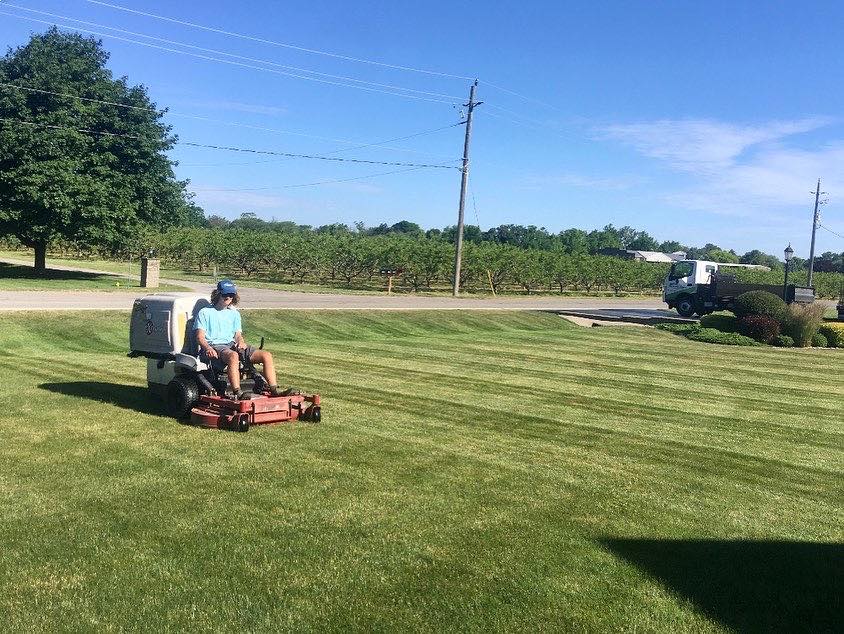 Cutting Edge Lawn crew doing lawn maintenance on a property in Azilda Ontario