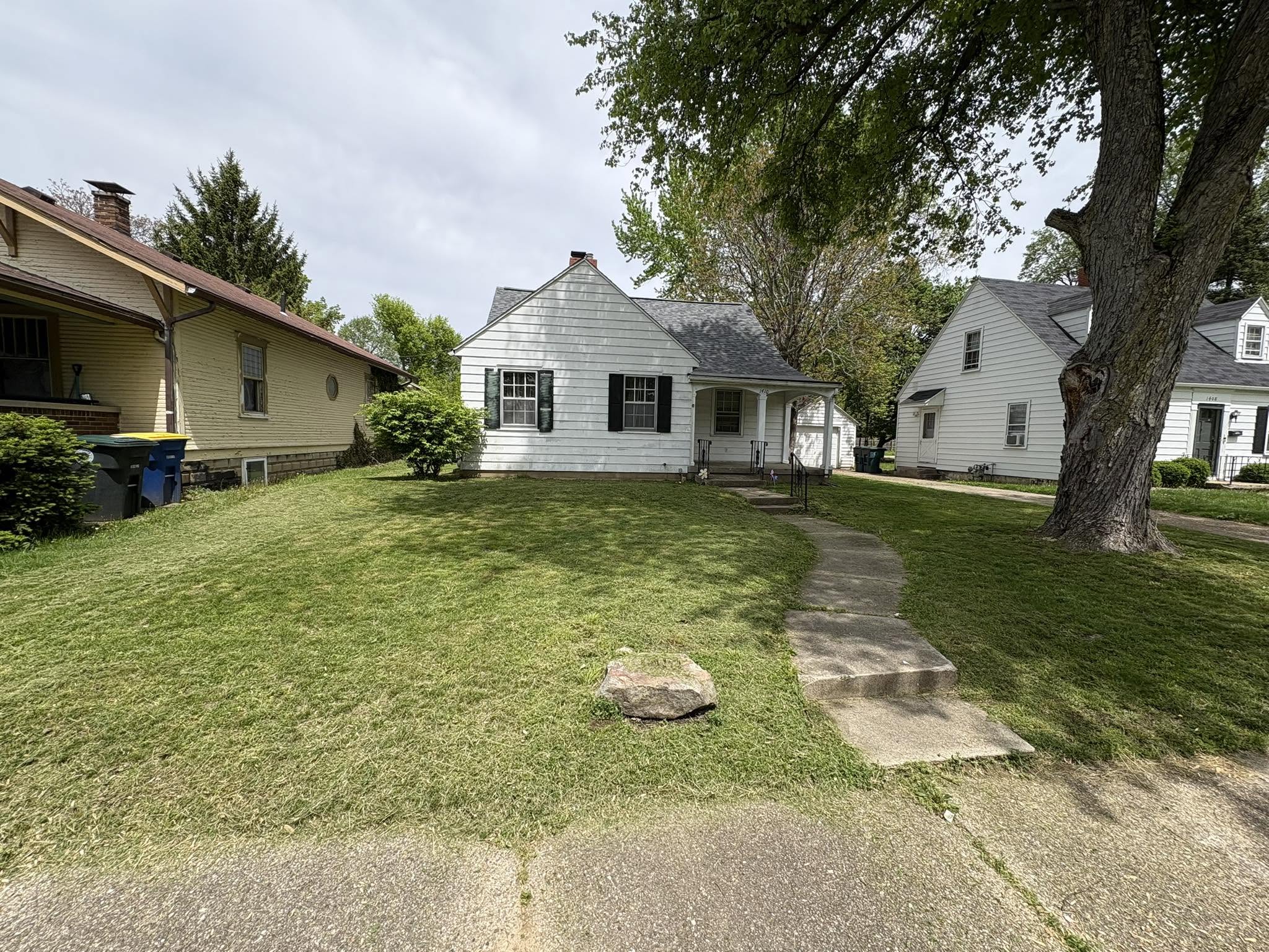Disappointed homeowner looking at unchanged struggling Sudbury lawn