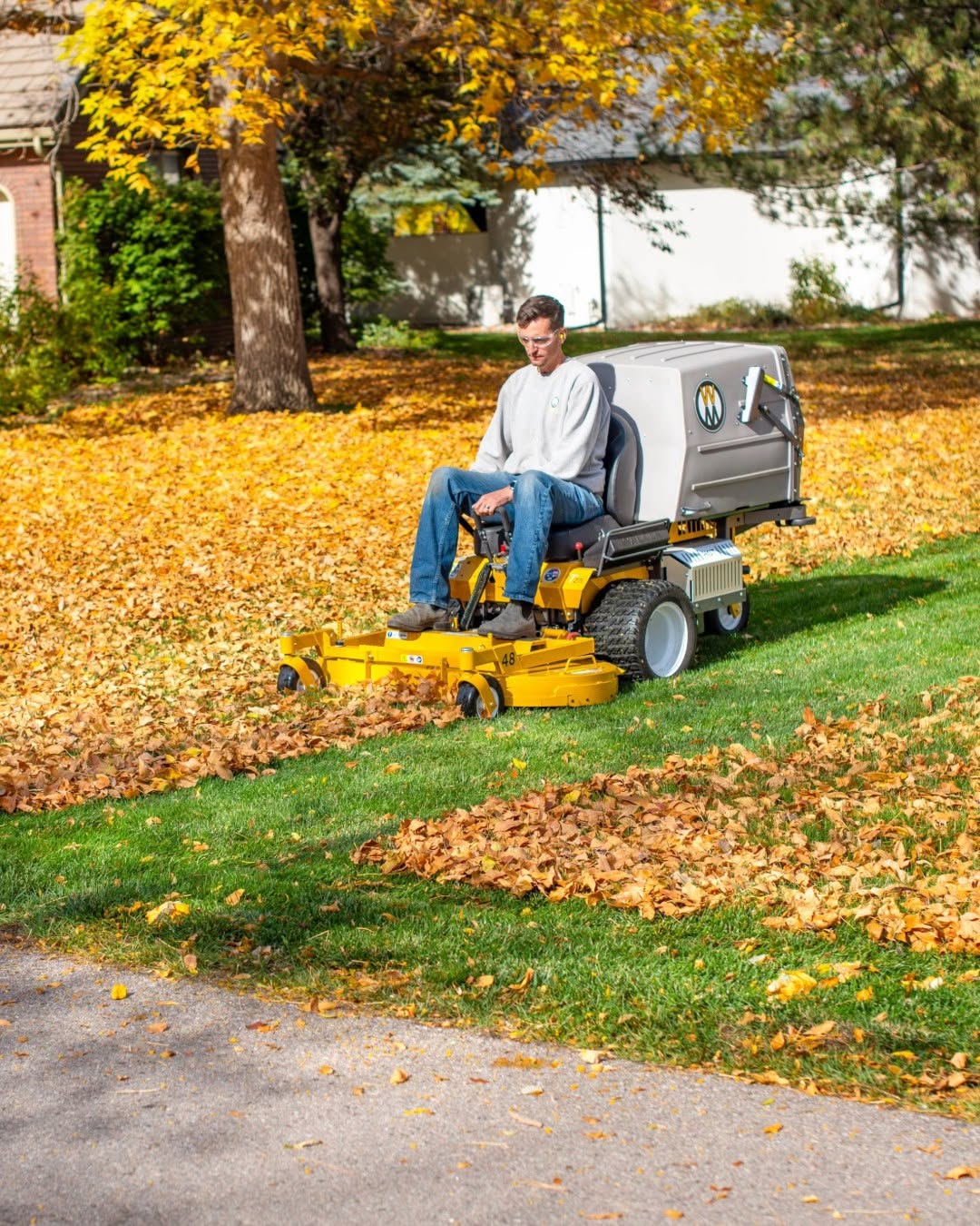 Fall lawn cleanup and final mow on Sudbury property before winter