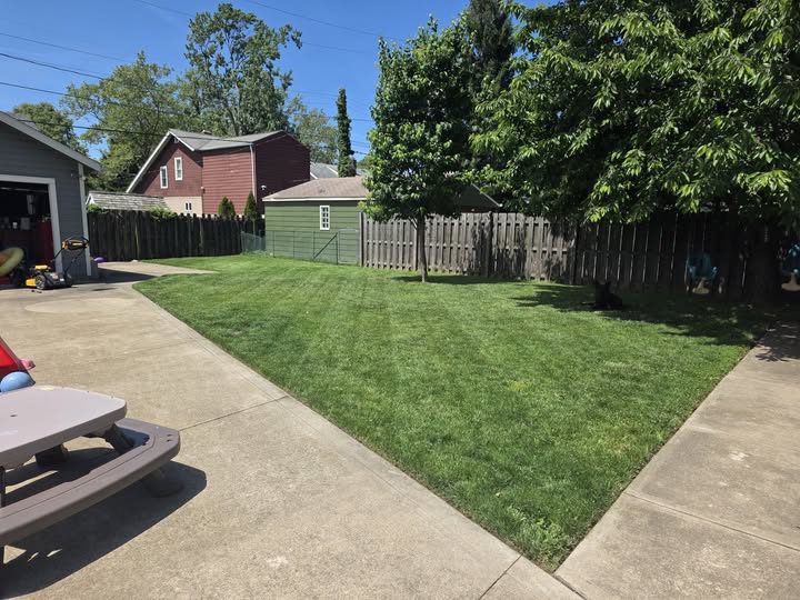 Freshly cleaned up residential lawn after Sudbury property maintenance visit