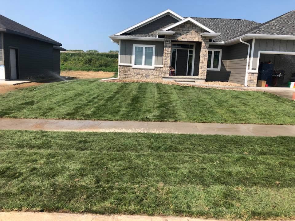 Lawn aeration overseeding fertilizing timing Sudbury Ontario spring schedule