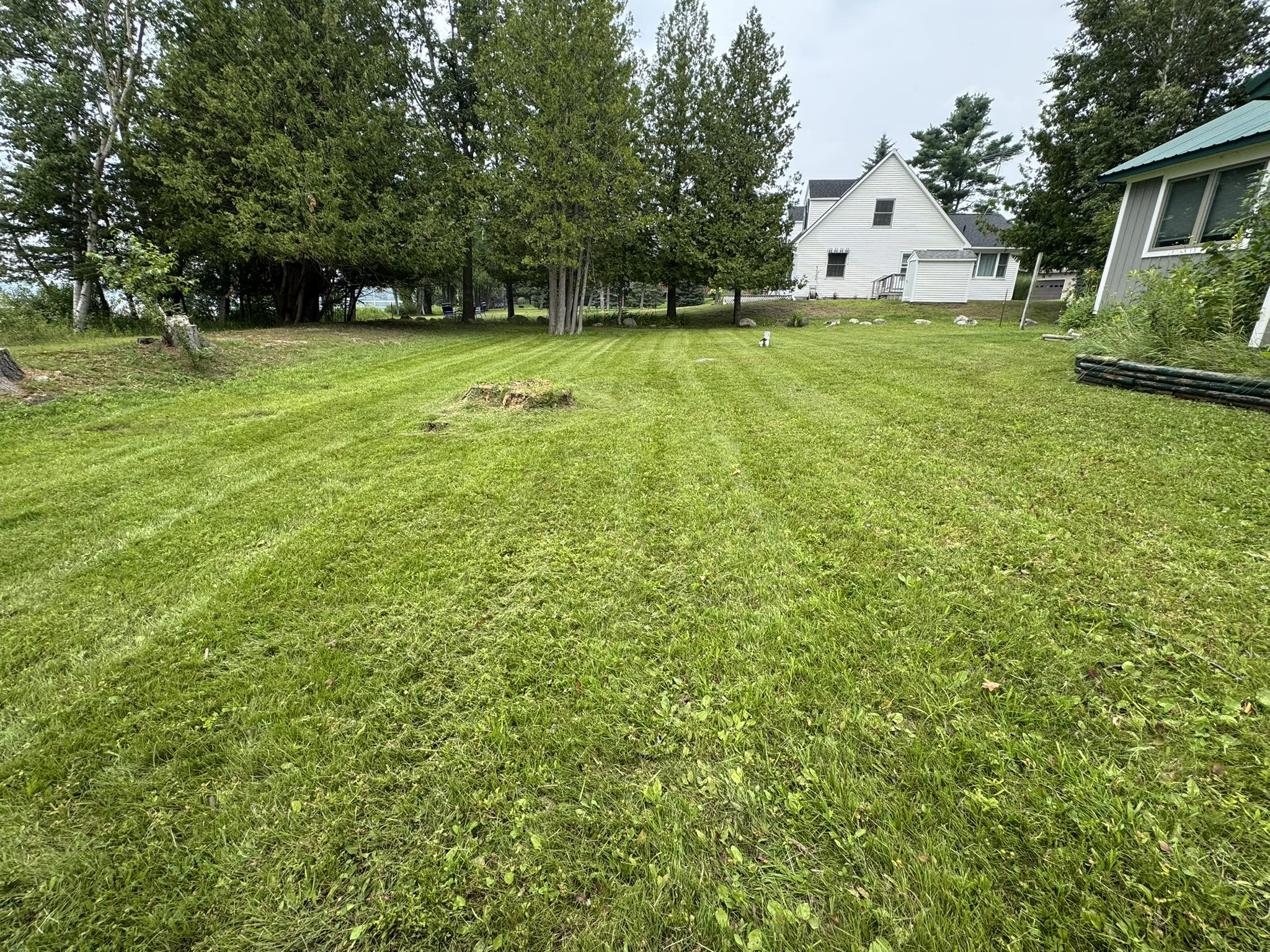 Healthy green lawn being maintained on a New Sudbury Ontario residential property