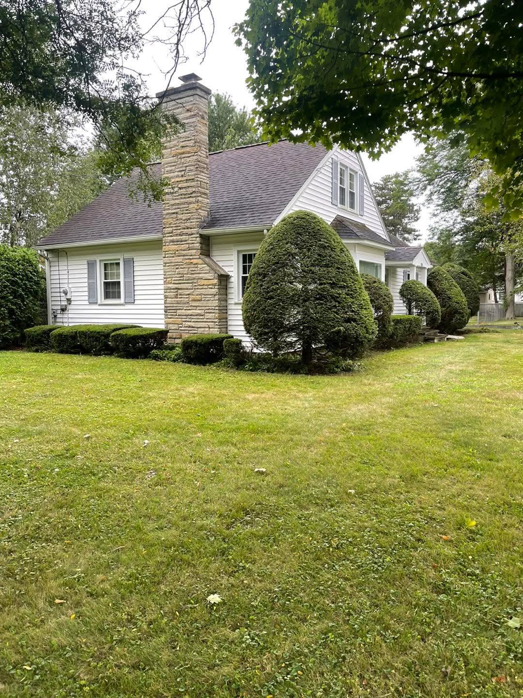 Healthy well-maintained residential lawn in Greater Sudbury Ontario cared for by Cutting Edge Lawn and Landscaping