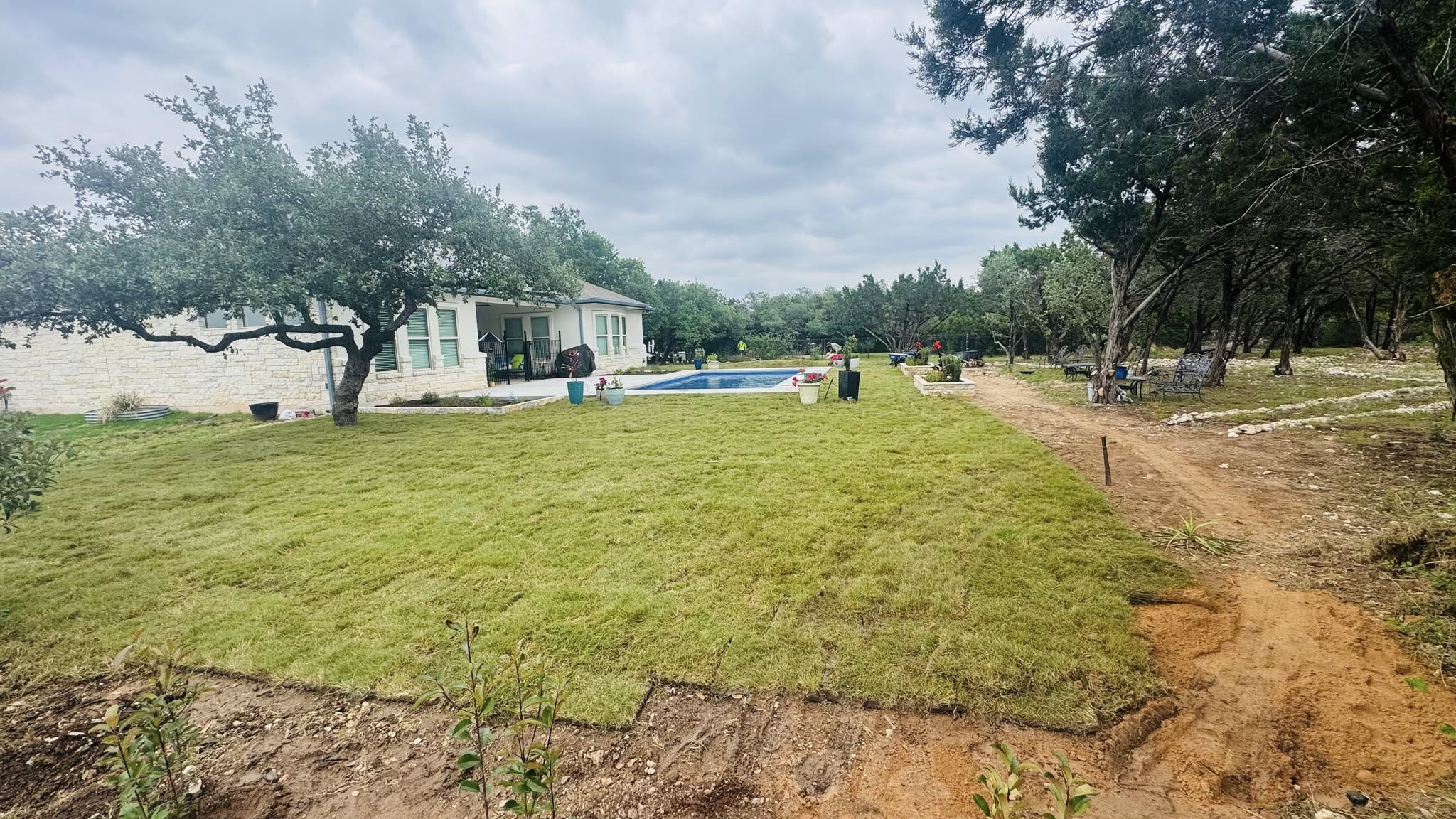 Homeowner interviewing sod installation company Ontario residential property