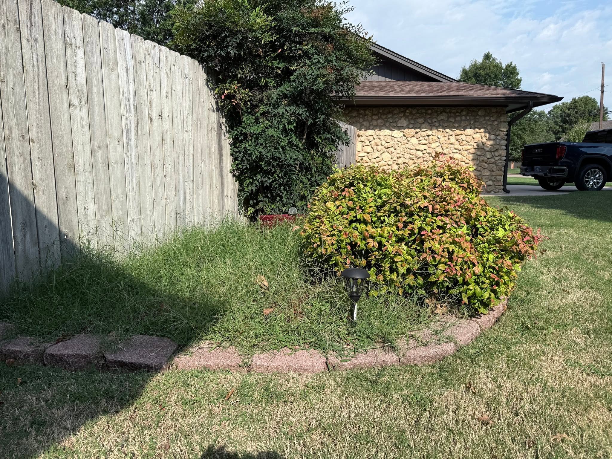 Homeowner reviewing cancellation clause in Sudbury lawn care service contract