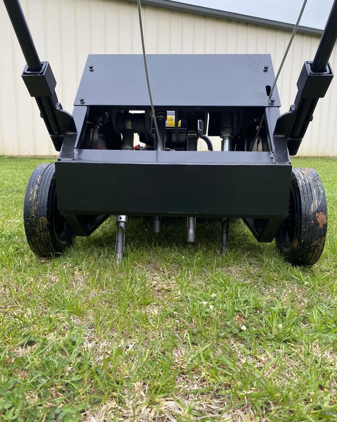 Lawn repair and aeration work in progress on Sudbury property summer