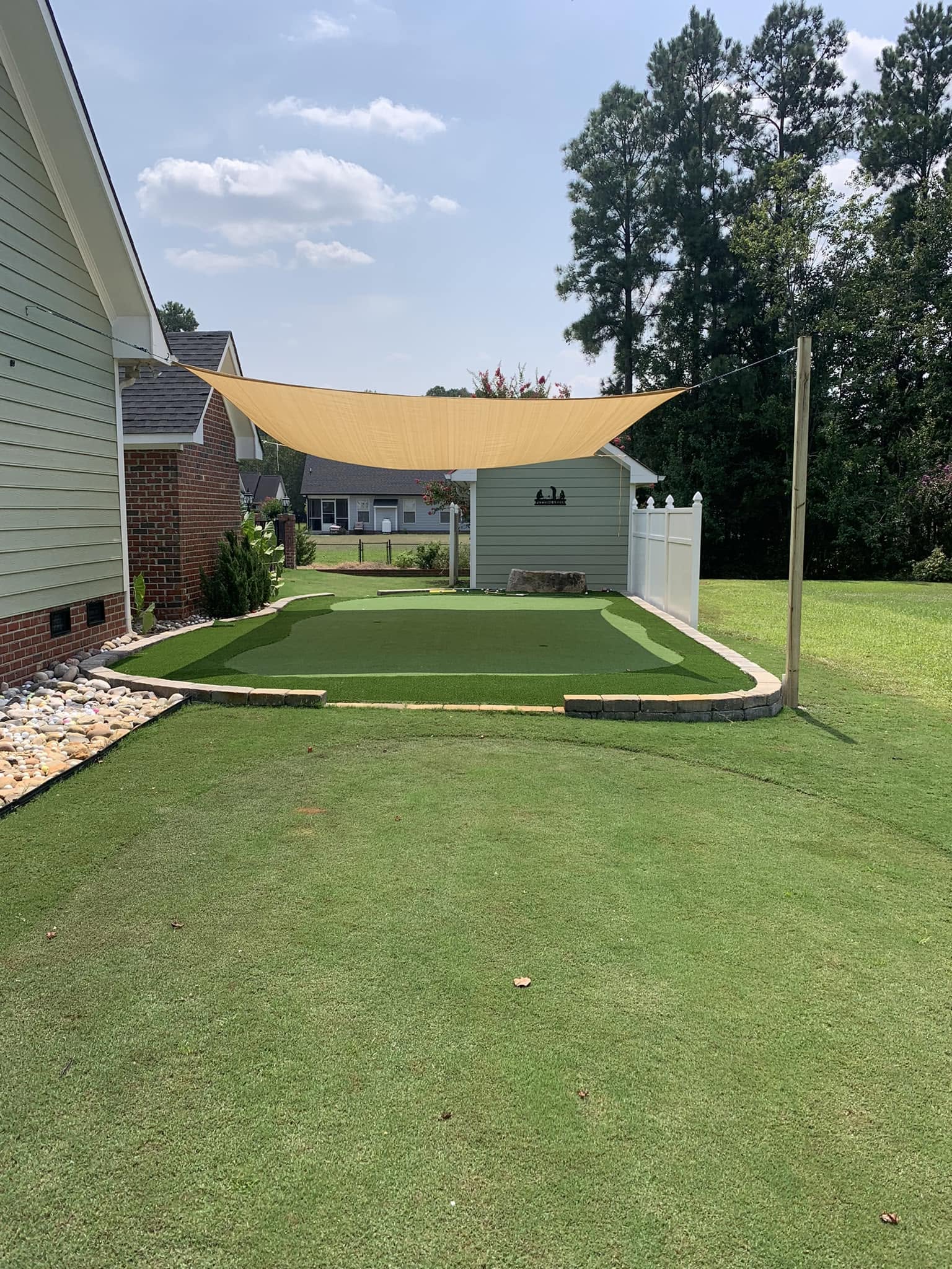 Light shade cloth over new sod during a heat spell in Greater Sudbury