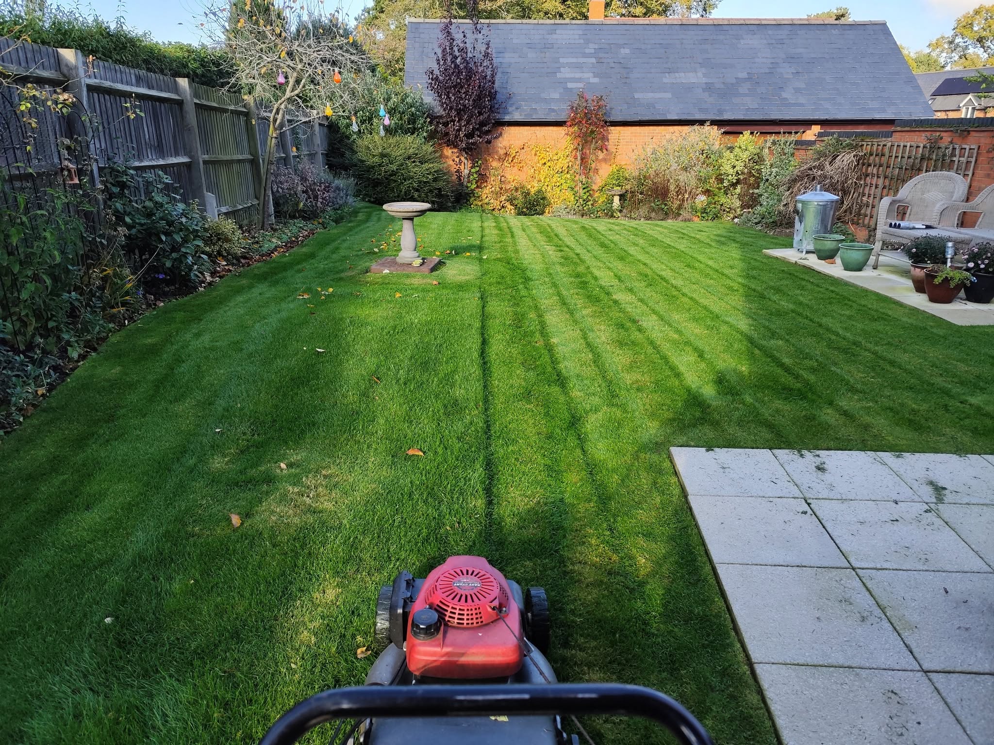 Notebook with lawn care call notes from Sudbury customer tracking