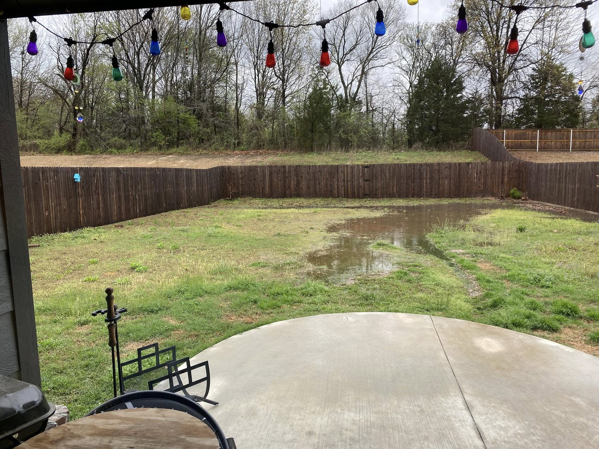 Residential property in Greater Sudbury Ontario with low lying lawn area prone to flooding