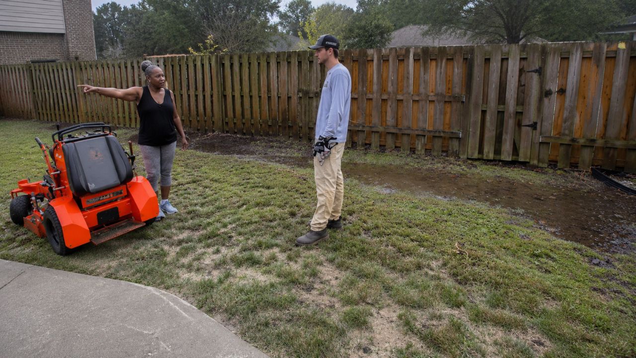 Ryan Lingenfelter assessing a lawn on a Sudbury Ontario property