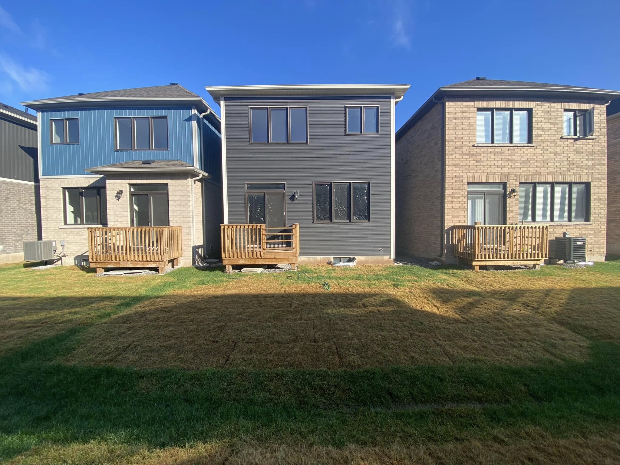 Ryan Lingenfelter checking established sod residential lawn Greater Sudbury Ontario first cut after installation