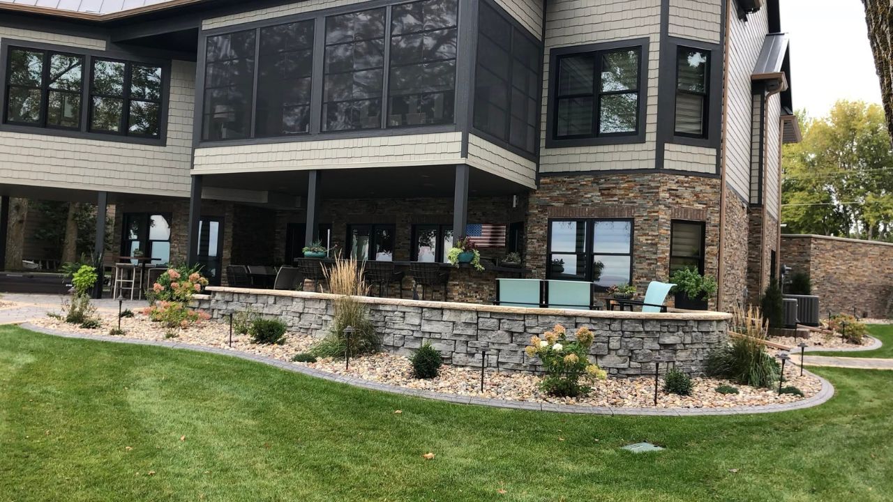 Ryan Lingenfelter checking lawn grade and clearance around residential foundation Greater Sudbury Ontario