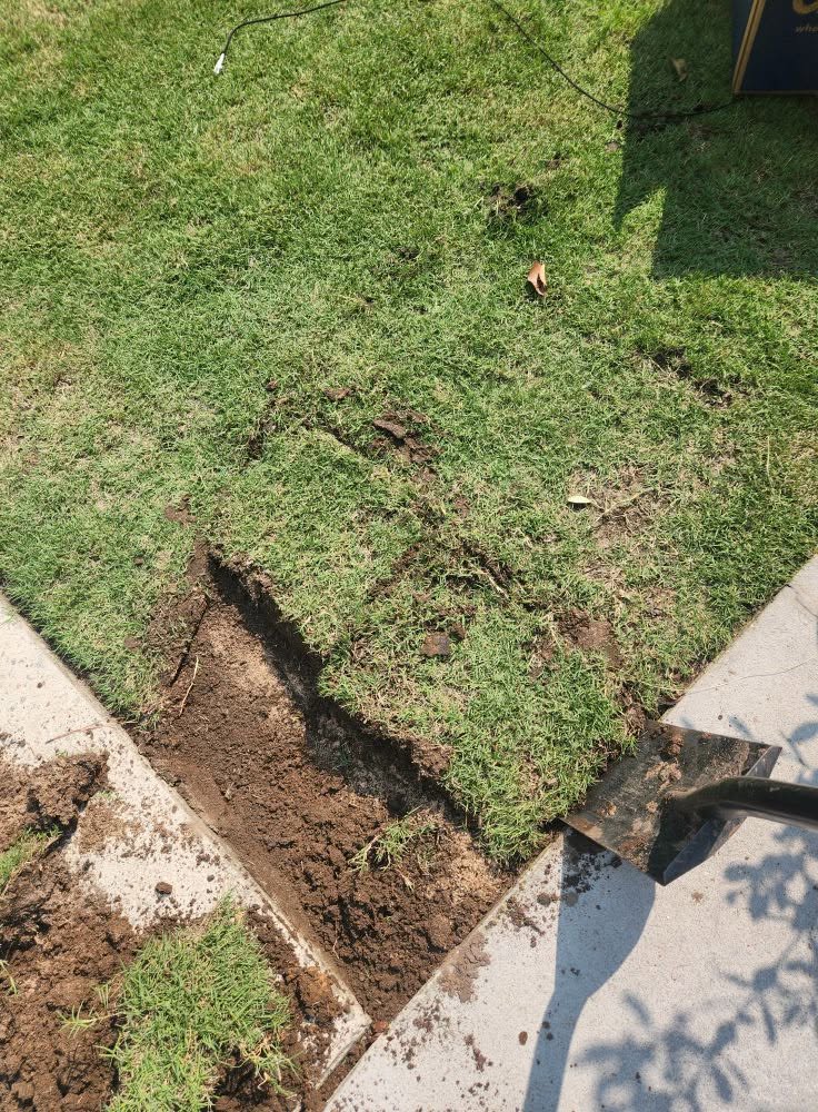 Ryan Lingenfelter explaining Sudbury specific sod installation approach to homeowner