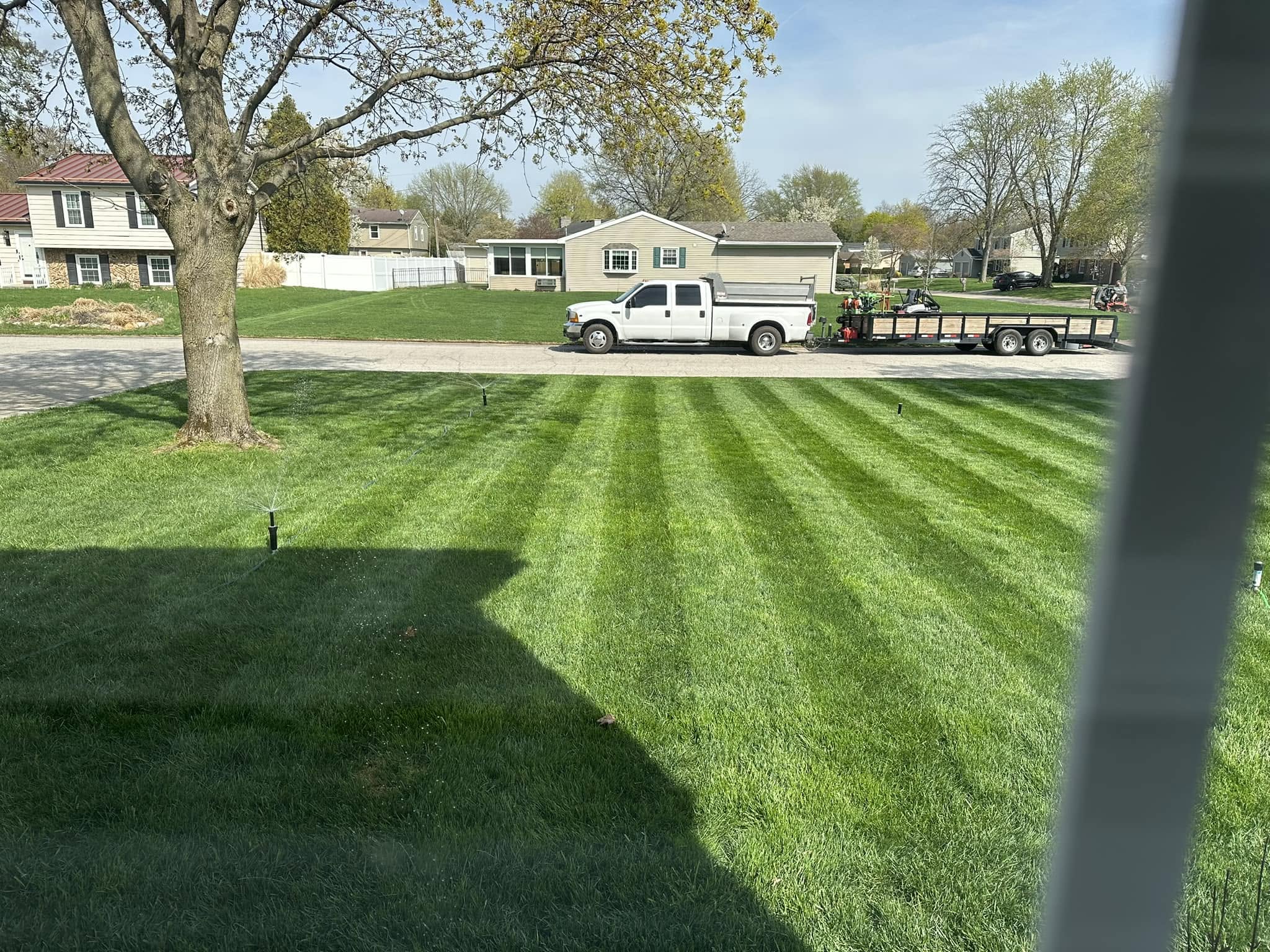 Ryan Lingenfelter explaining lawn care consistency homeowner Greater Sudbury Ontario neighbour comparison
