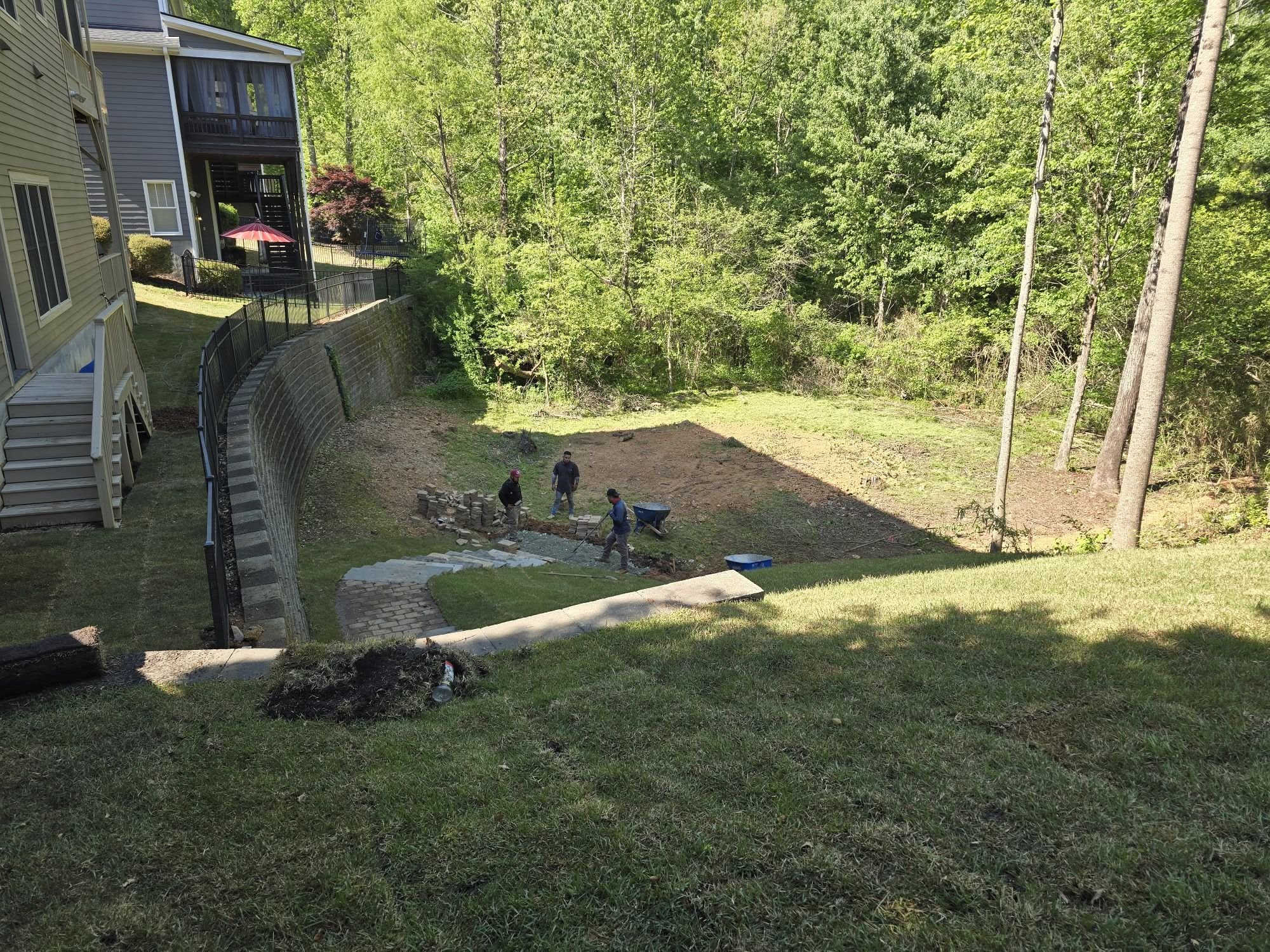 Ryan Lingenfelter inspecting fresh sod quality before residential installation Greater Sudbury Ontario