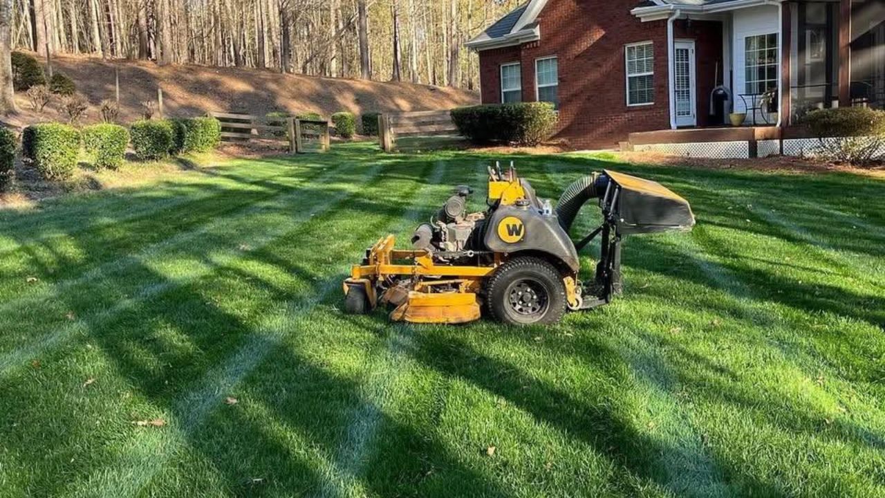 Ryan Lingenfelter speaking with homeowner about questions before hiring lawn care company Greater Sudbury Ontario
