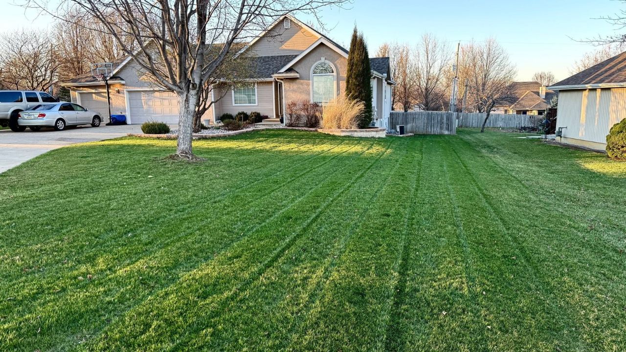 Ryan Lingenfelter walking a residential property for a lawn care quote in Greater Sudbury Ontario