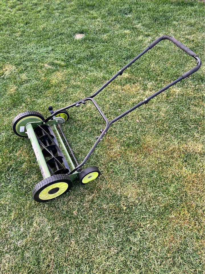 Simple traditional lawn mower producing better results than complex equipment on Sudbury Ontario property