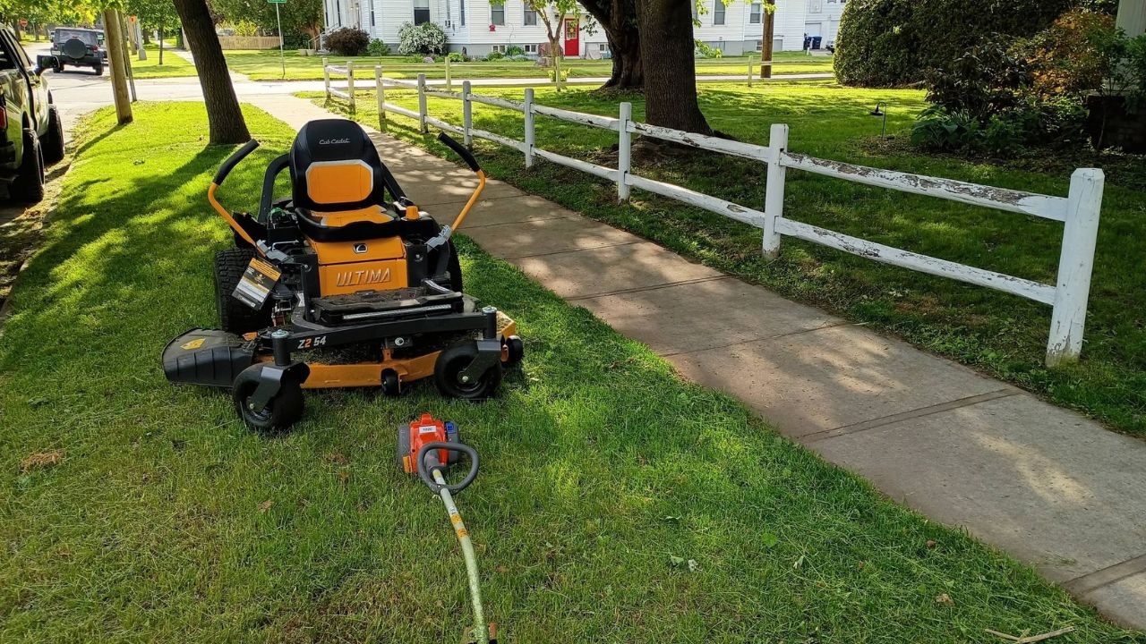 Small lawn care crew working on a residential property in Greater Sudbury Ontario