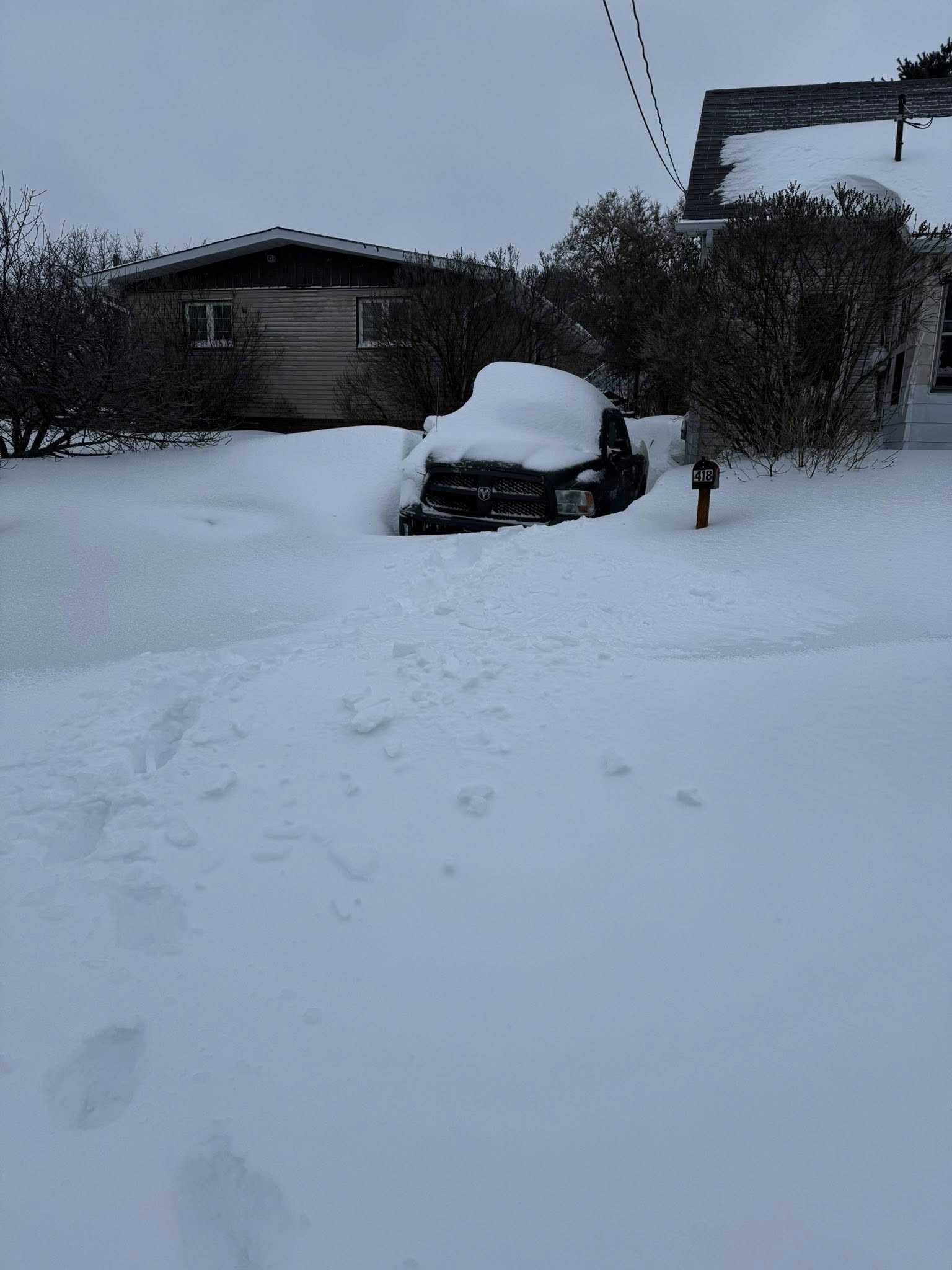 Snow covered residential lawn in Greater Sudbury Ontario winter