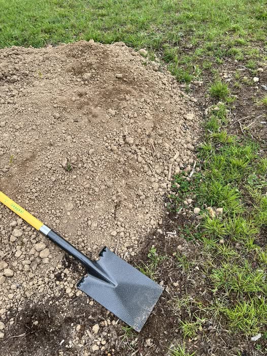 Soil knife and manual edging tool used for lawn care by Sudbury Ontario homeowner