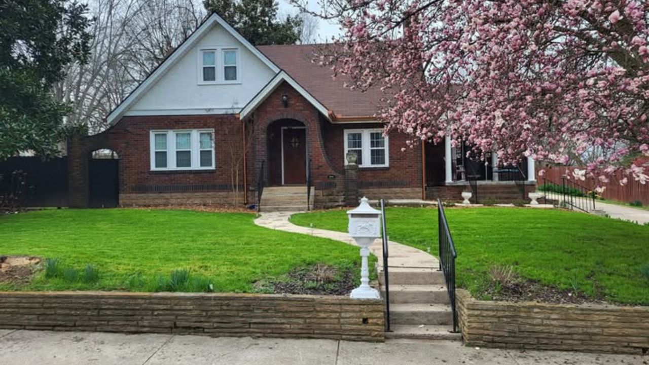 Sudbury Ontario homeowner comparing two different lawn mowing quotes side by side
