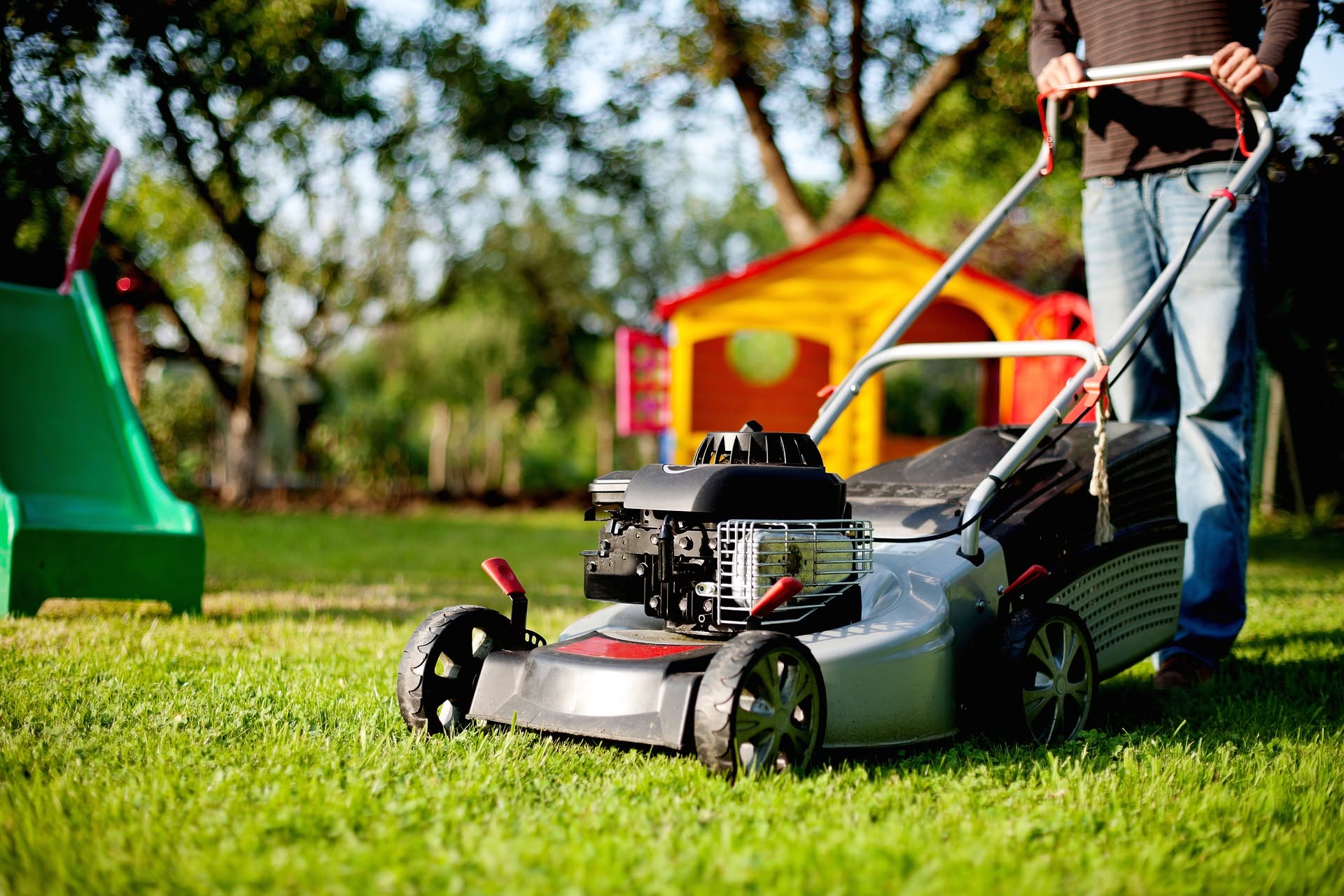 Sudbury Ontario homeowner maintaining consistent lawn care routine resulting in great lawn in July