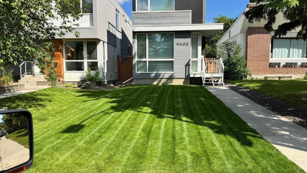 Sudbury Ontario homeowner reviewing lawn care bill with Ryan Lingenfelter at her property