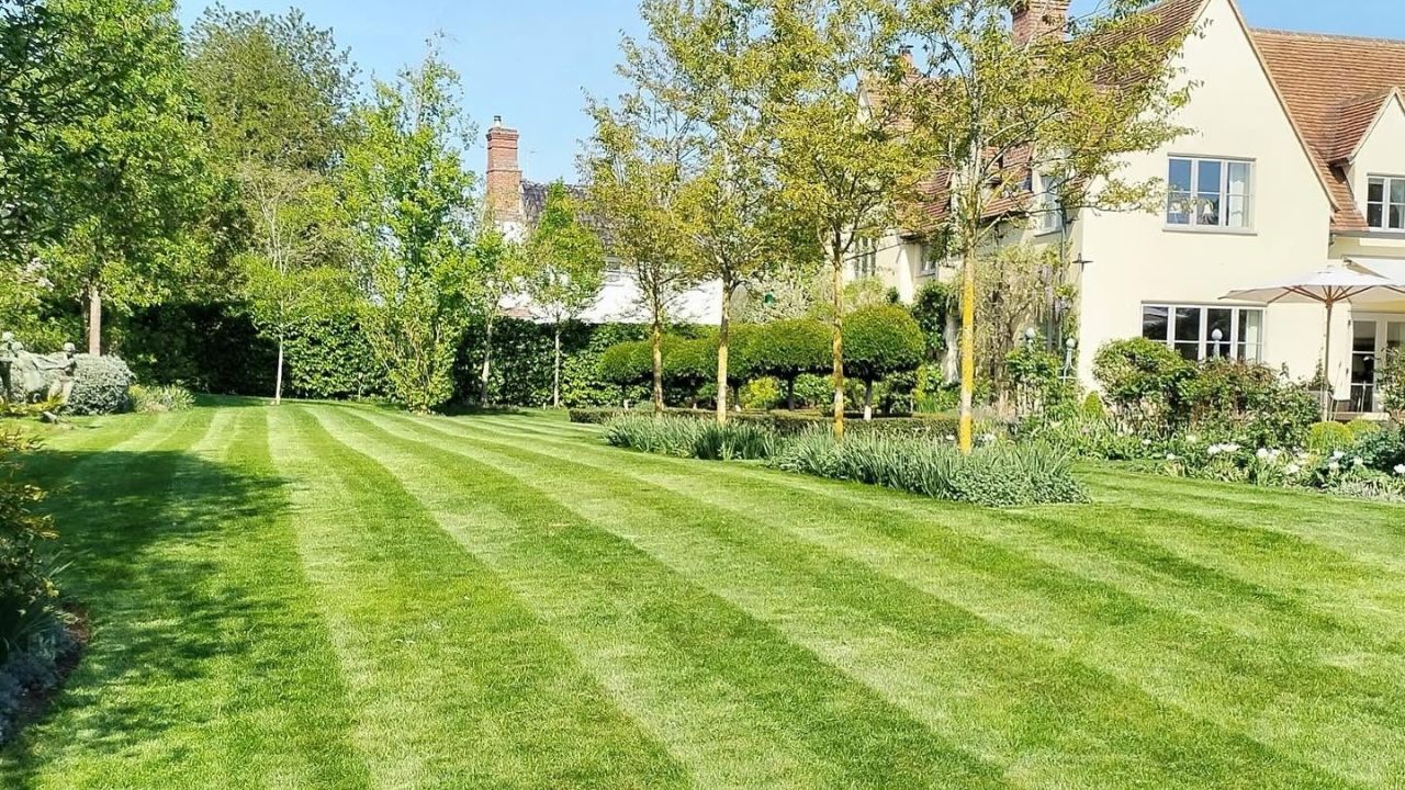 Sudbury Ontario homeowner spending time on lawn care maintenance throughout the season