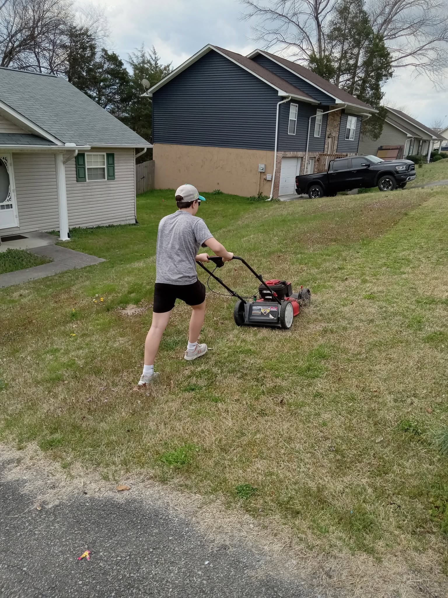 Sudbury homeowner mowing and maintaining lawn showing full season time commitment