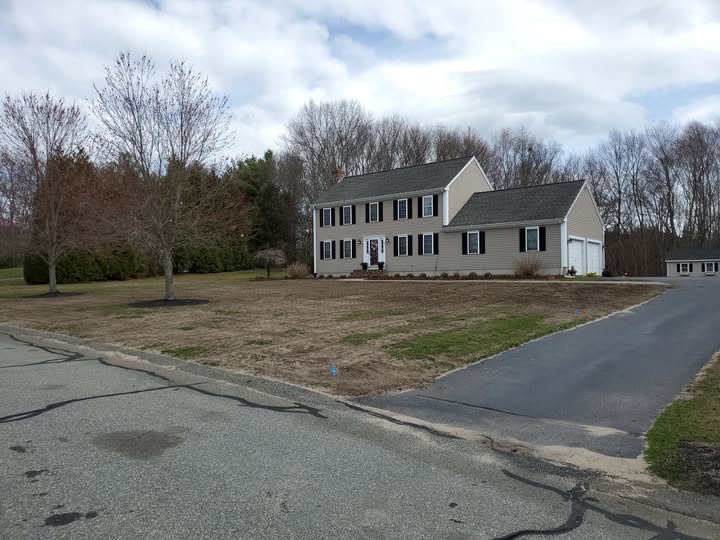 Sudbury Ontario residential lawn in early spring showing efficient low maintenance cleanup approach