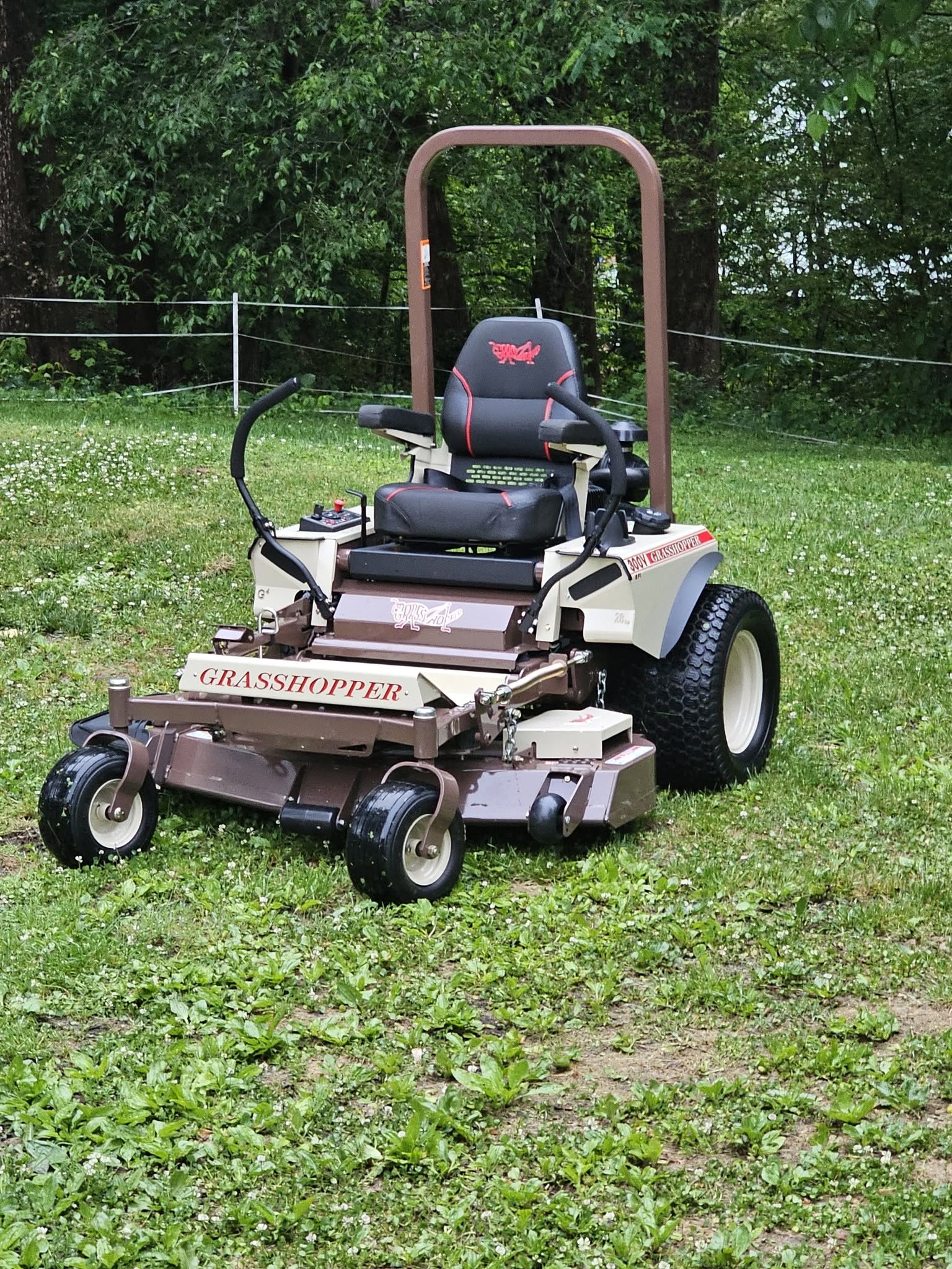 Sudbury homeowner reviewing a written lawn mowing quote on a clipboard